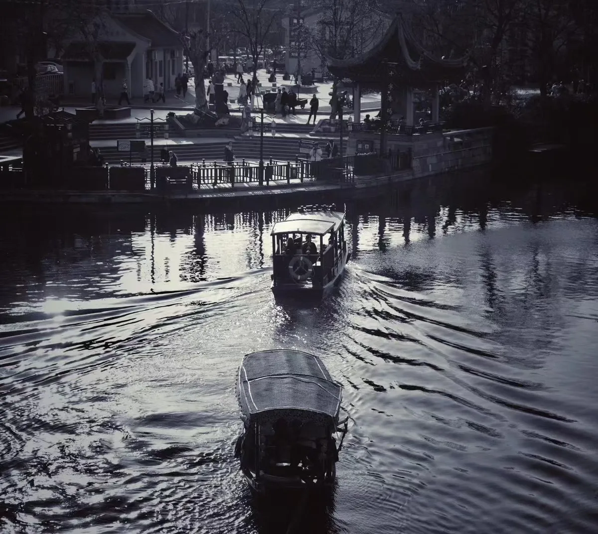 Boats Drifting Through an Old Town