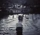 Boats Drifting Through an Old Town