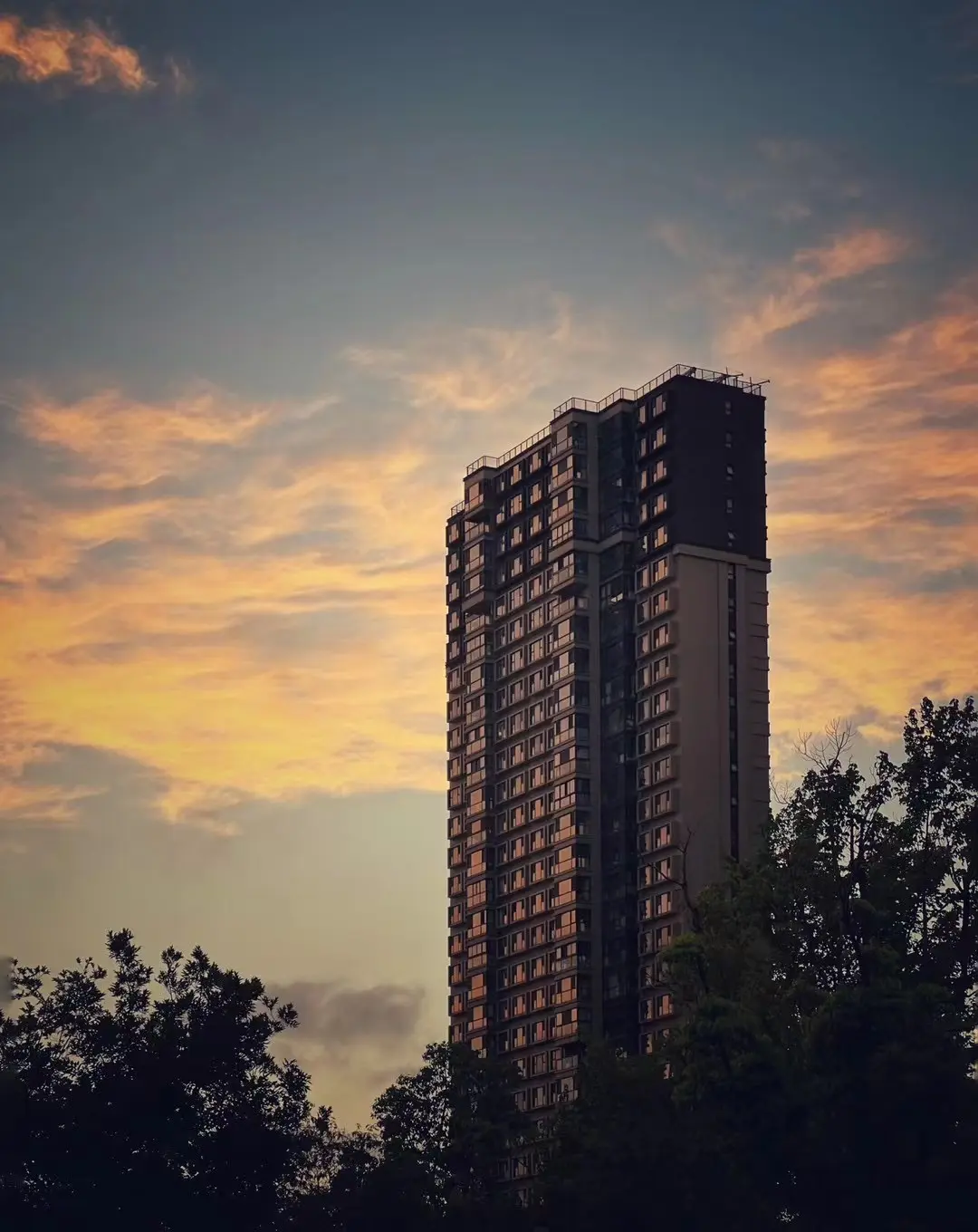 Sunset Glow on a Riverside Tower